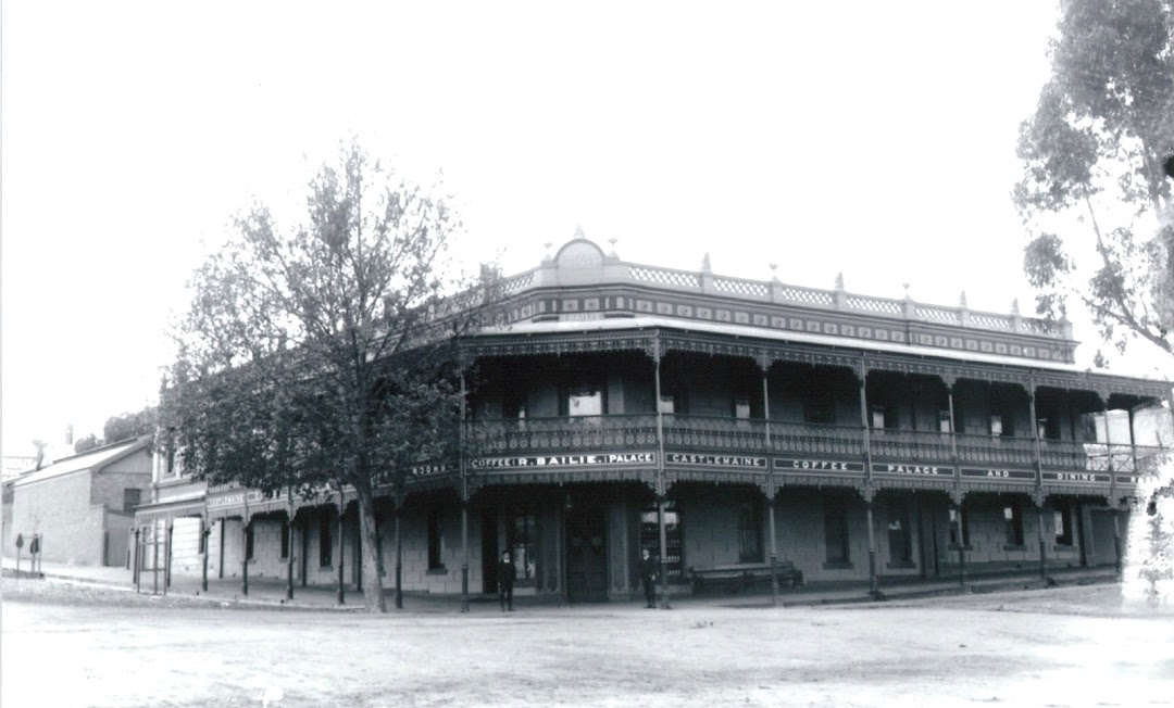 Old black and white photo of The Midland Accommodation Hotel.